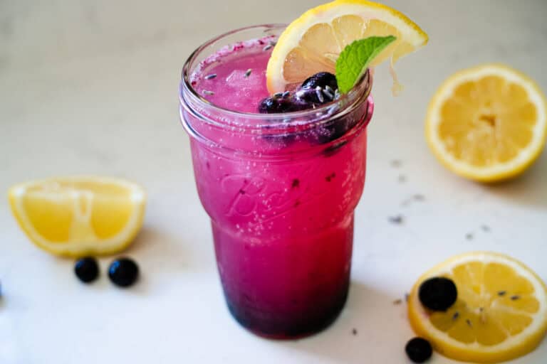 blueberry lavender lemonade served in a glass over ice