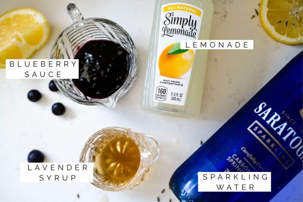 lavender syrup, blueberry sauce, lemonade, and sparkling water ready to assemble into a drink