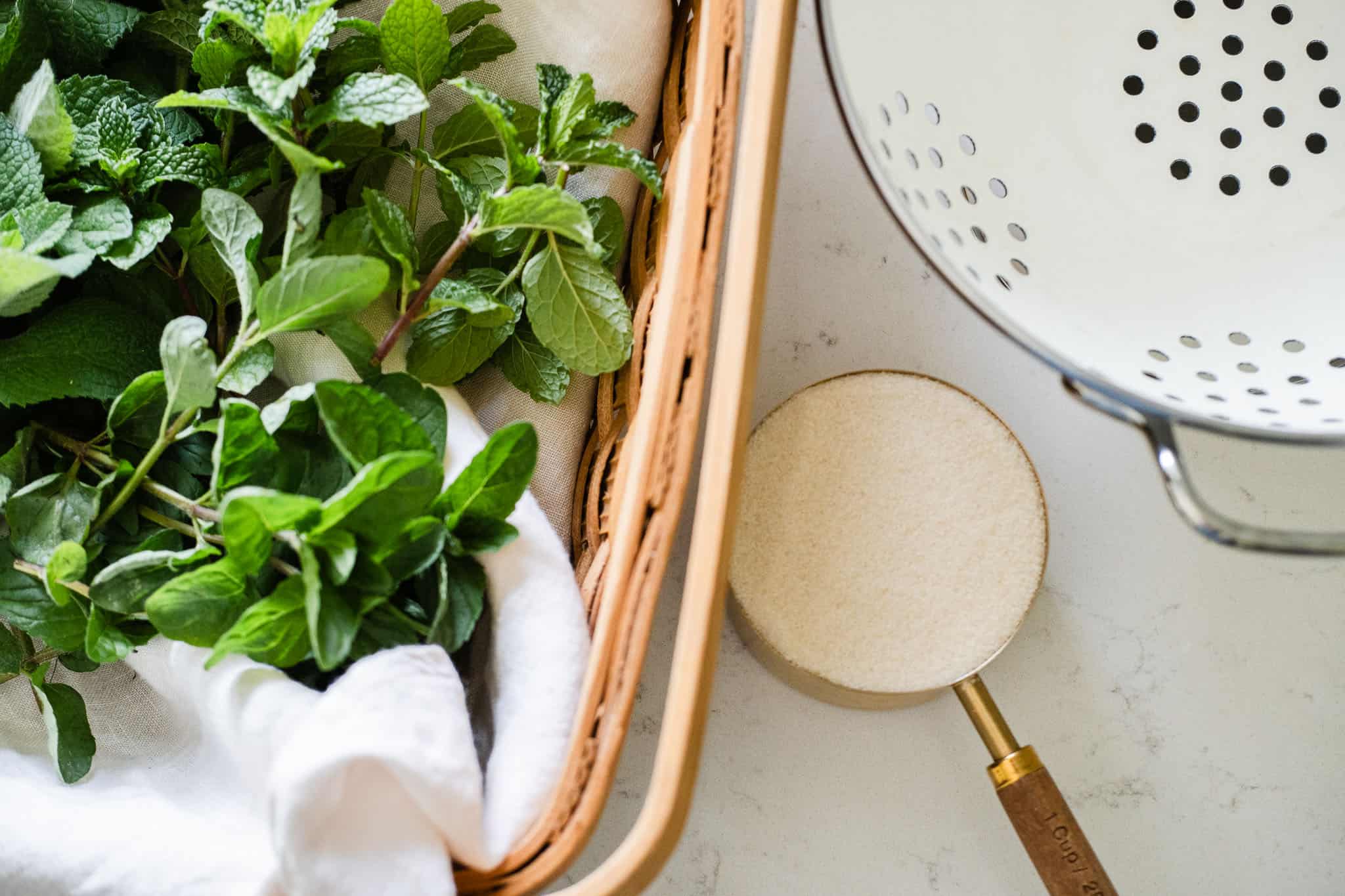mint leaves, sugar and strainer