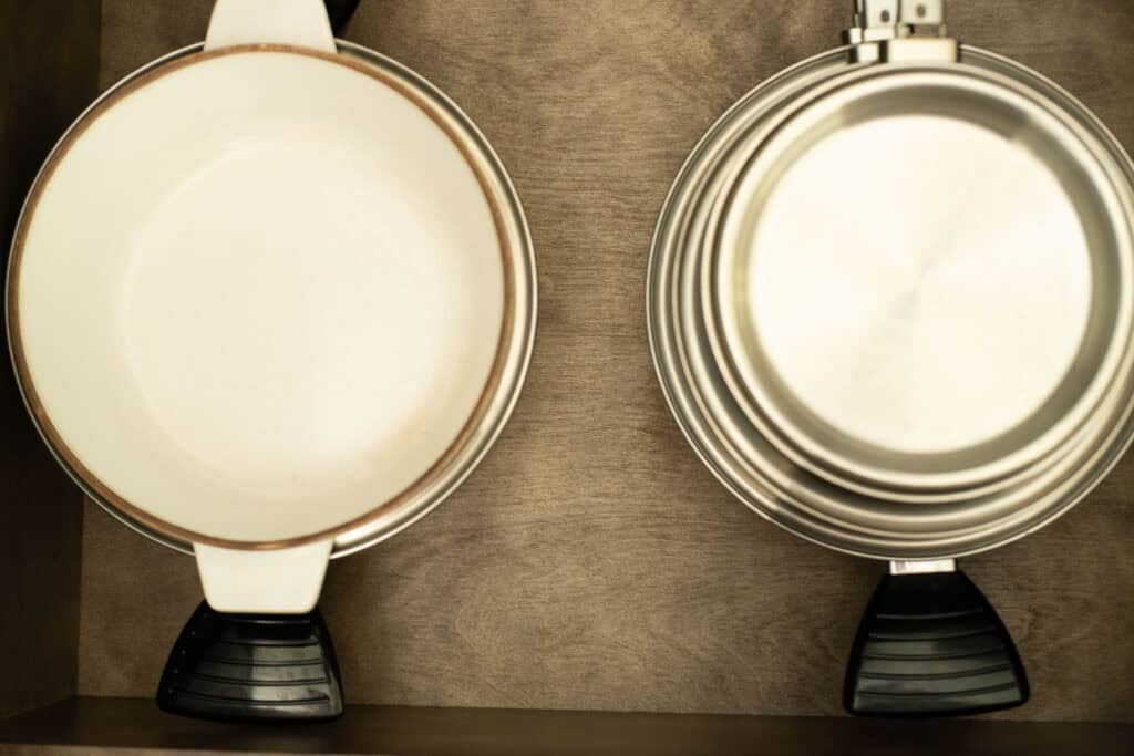 stacks of cookware in a kitchen drawer