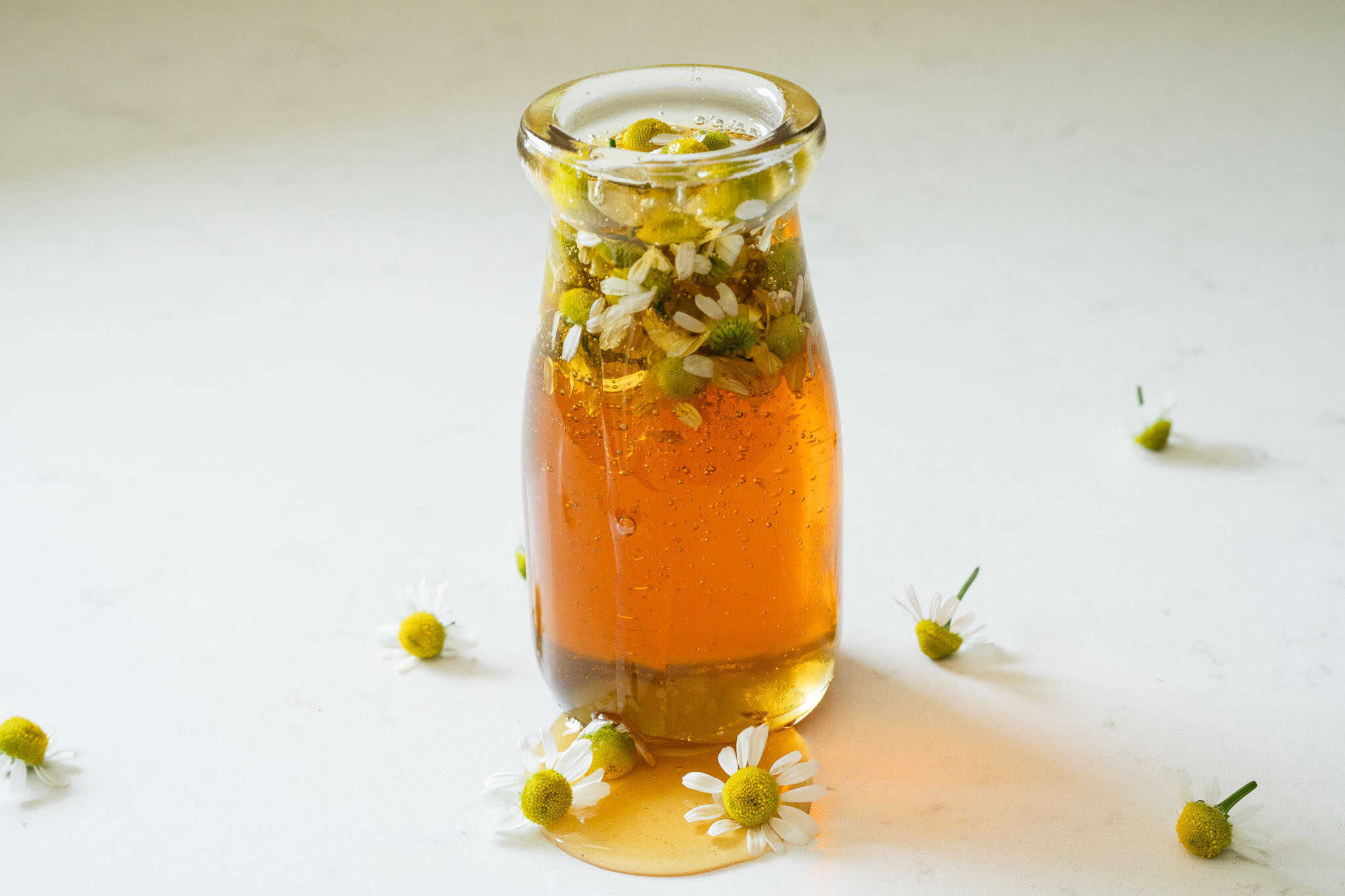 jar with flowers and honey