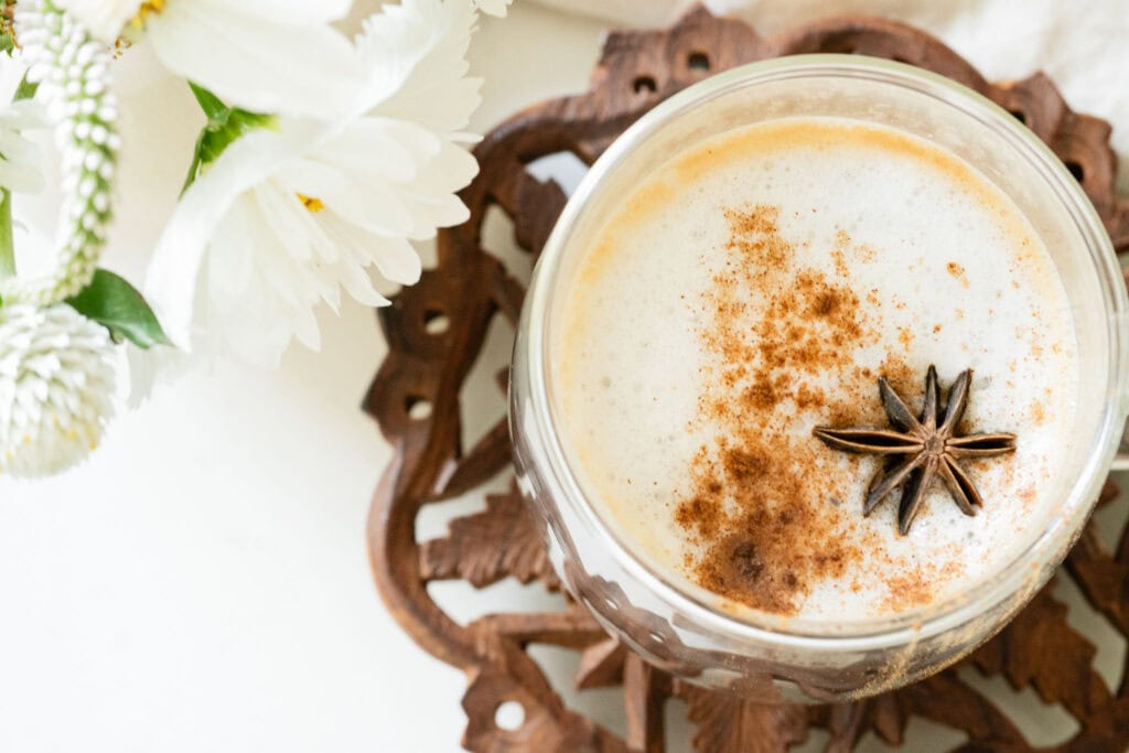 mug with chai, steamed milk and cinnamon