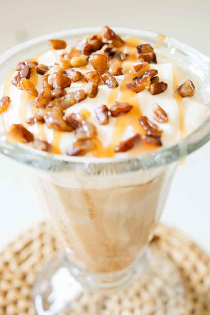 iced latte topped with toasted pecans