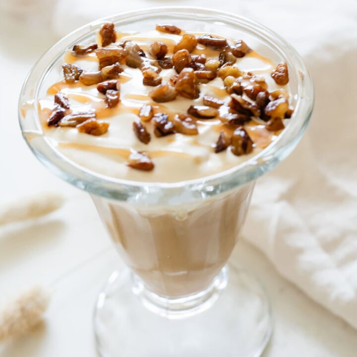 completed iced latte topped with pecans