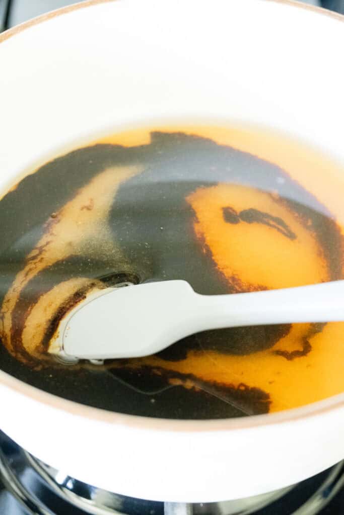 water, sugar, and molasses mixed in a saucepan