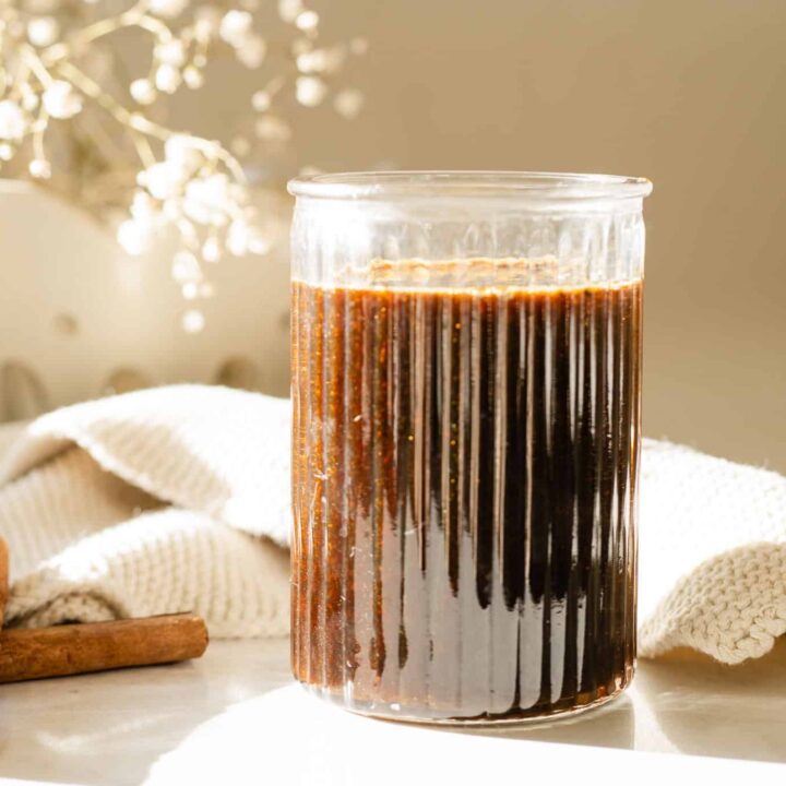 jar with syrup surrounded by spices