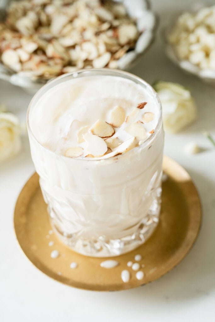 iced latte topped with sliced almonds