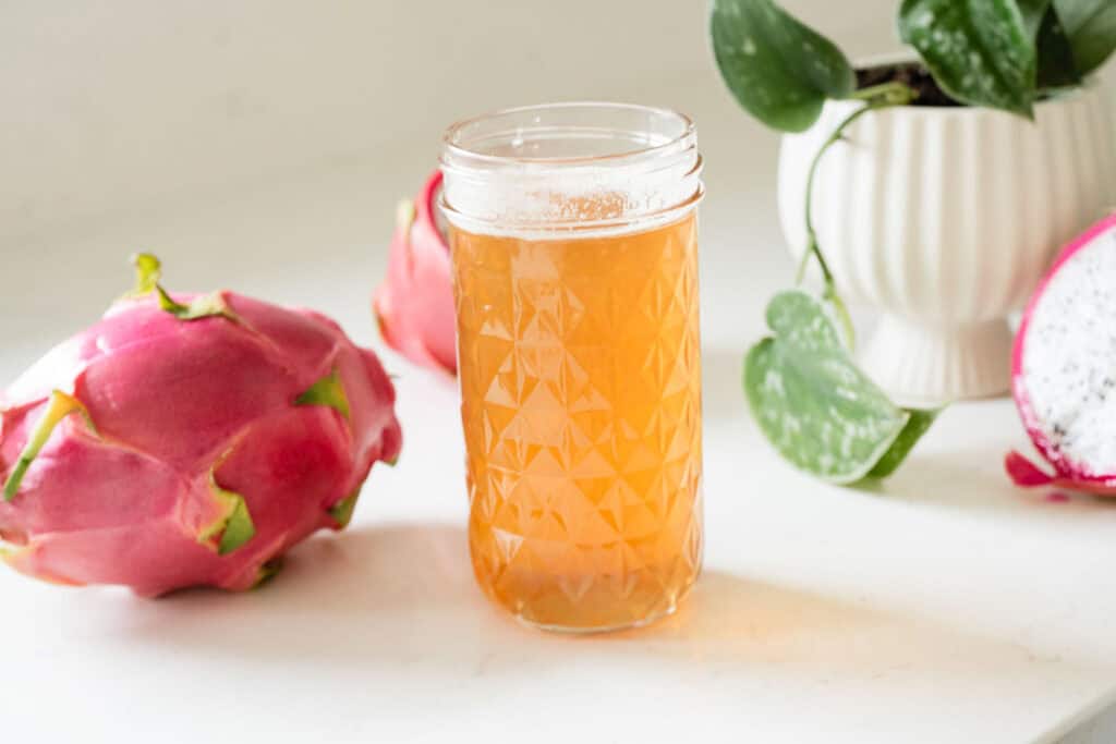 jar of syrup by dragon fruits