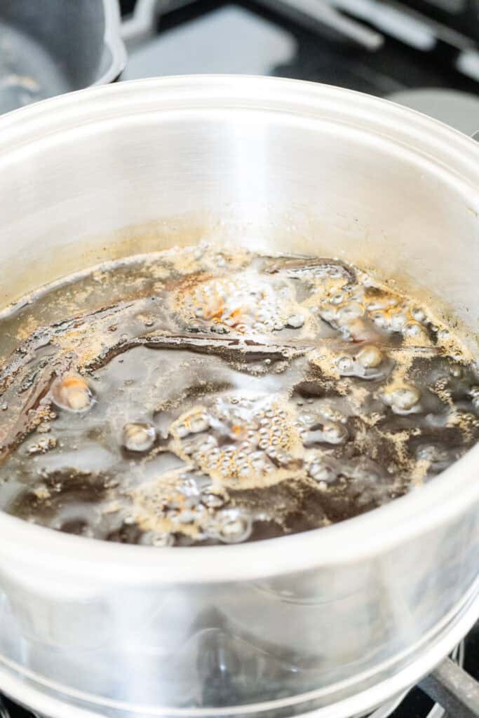 maple syrup and vanilla beans simmering