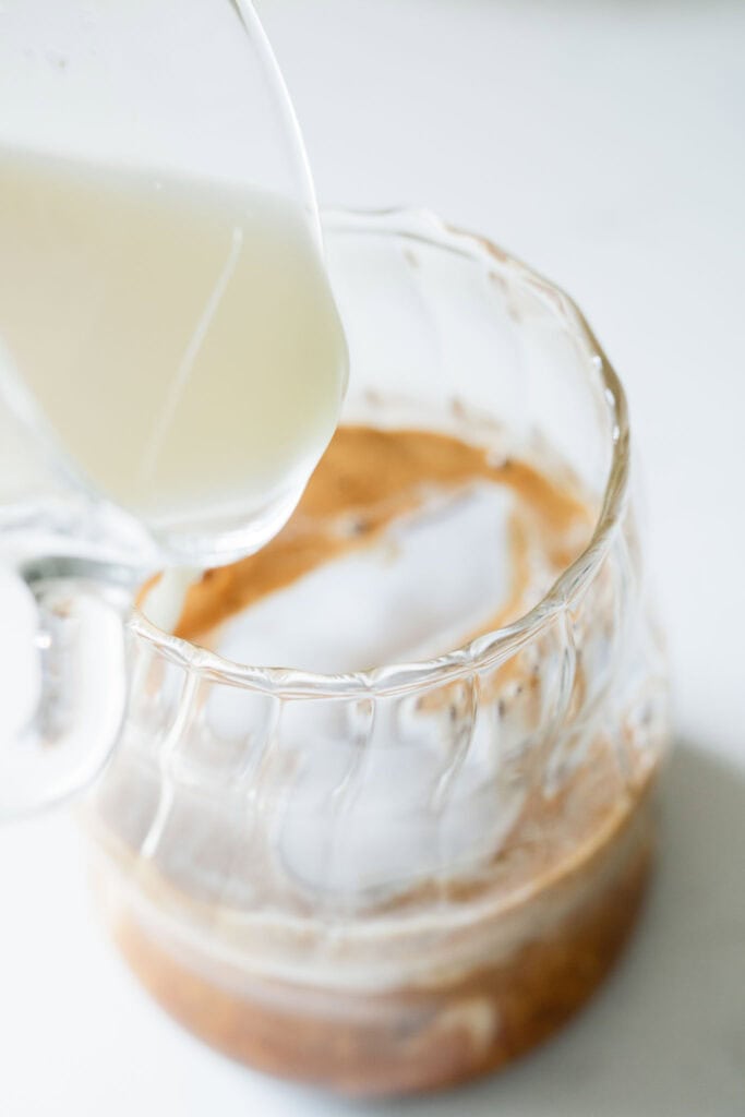 layering a healthy iced pumpkin spice latte