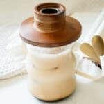iced latte with a wooden cocktail smoker