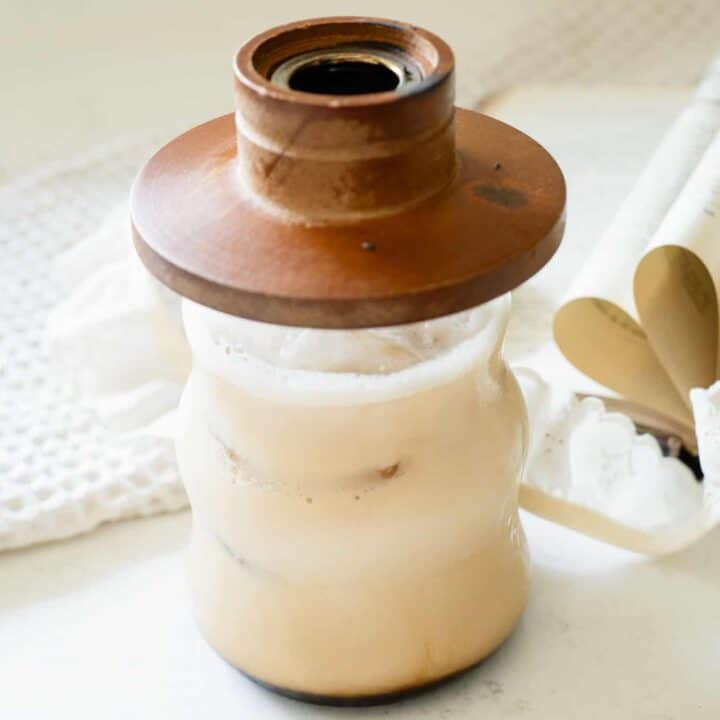 iced latte with a wooden cocktail smoker