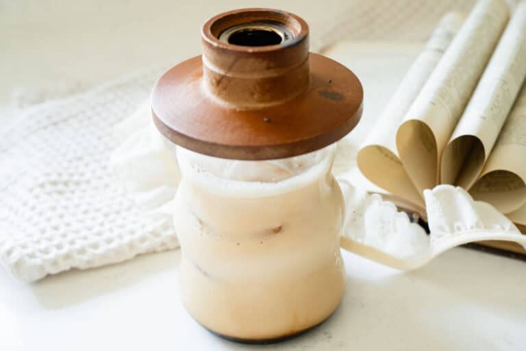 iced latte with a wooden cocktail smoker