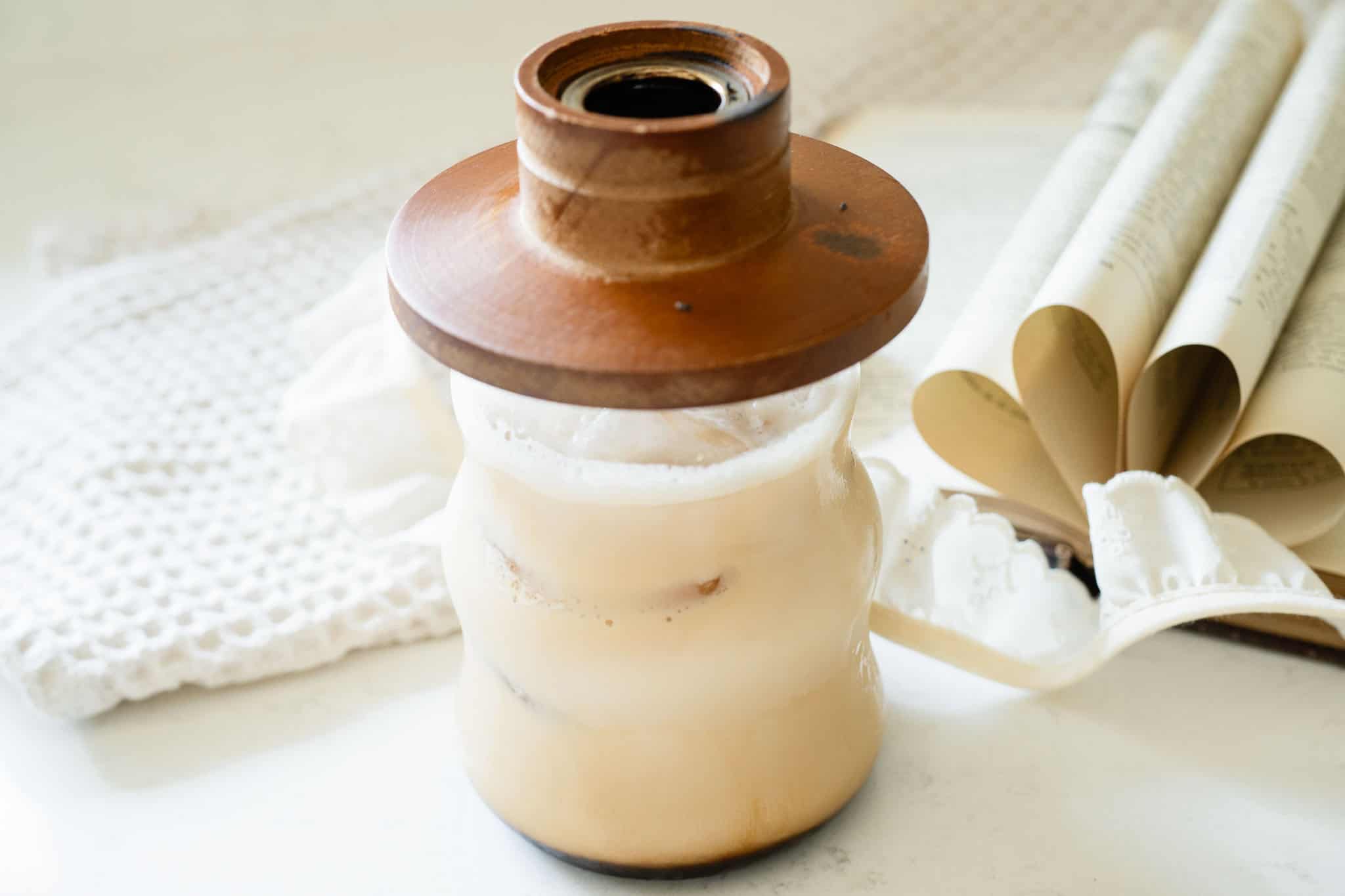 iced latte with a wooden cocktail smoker