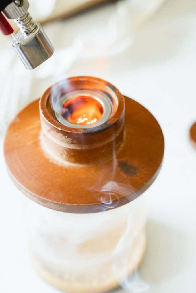 iced latte being smoked with a cocktail smoker